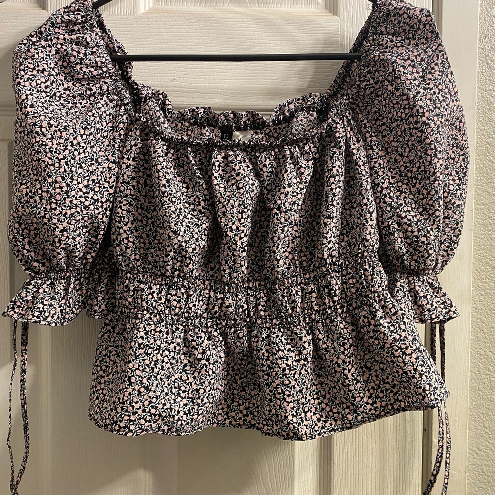 Pink and black floral ruffled square top with above elbow sleeves that tie.